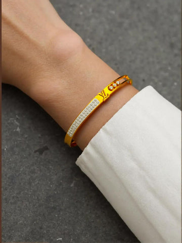 Stone-Studded Golden Bracelet with LV Brand Logo