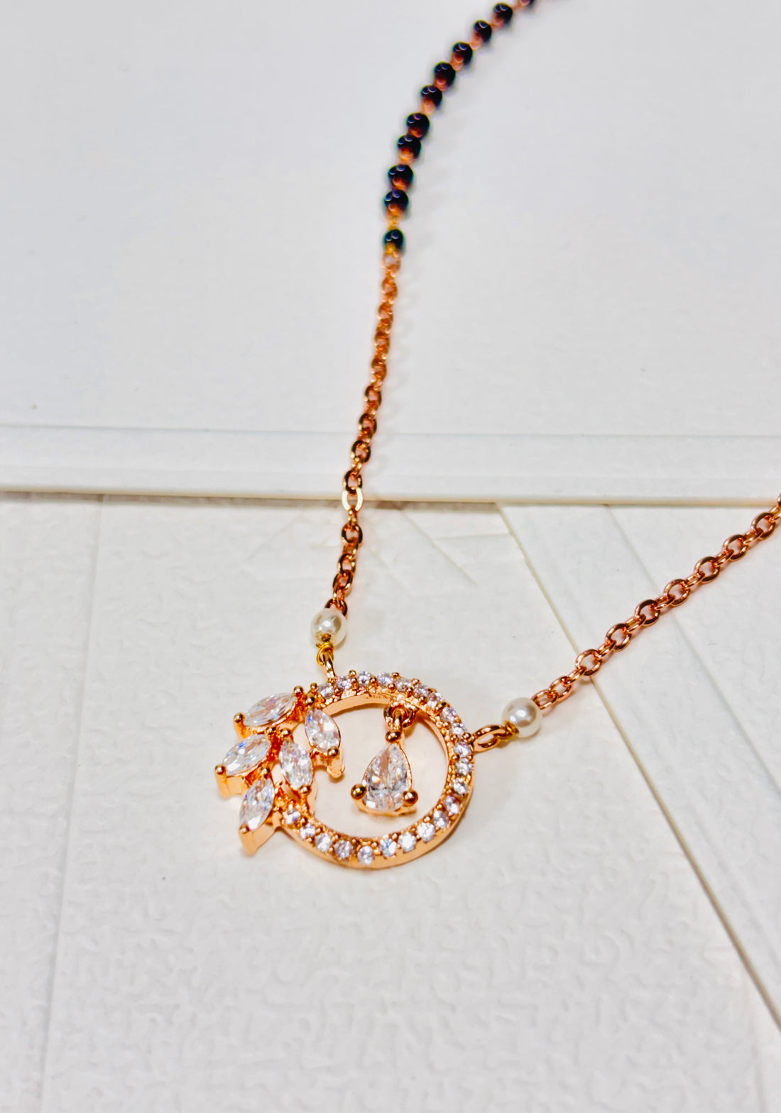 Rose Gold Chain Necklace with Black Beads and Diamond-Studded Circular Pendant